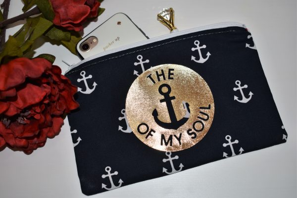 Zipper Pouch, Back: 'Anchor of My Soul' in gold vinyl, navy fabric with white anchors; white zipper