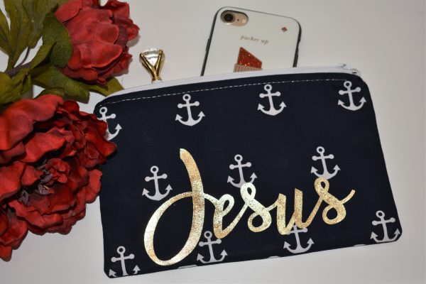 Zipper Pouch, Front: 'Jesus' in gold vinyl, navy fabric with white anchors; white zipper